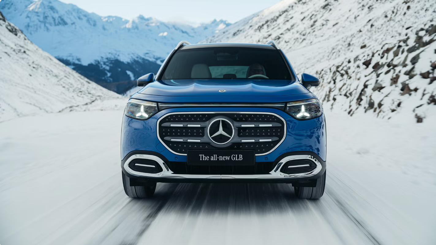 2027 Mercedes-Benz GLB parked outdoors, showcasing its sleek SUV design and modern headlights.